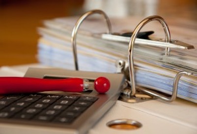Calculator next to the papers